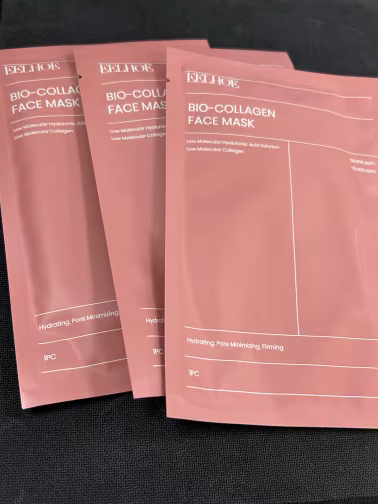 Three pink Bio-Collagen Face Mask sheet packets featuring Hyaluronic Acid and Collagen for anti-aging and hydration.
