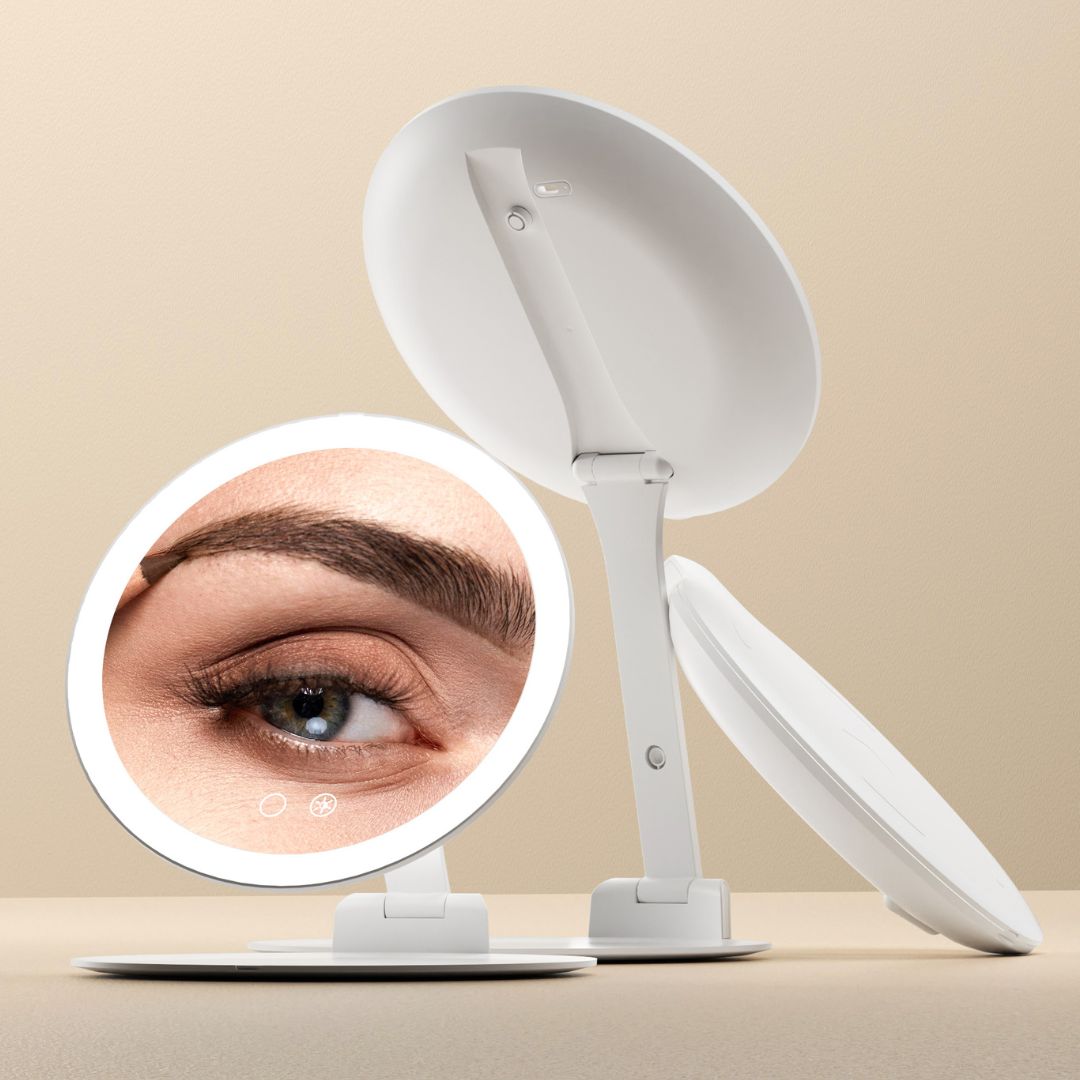 Abigail portable travel mirror with 10x magnification, LED ring light, and folding swivel stand for makeup application.