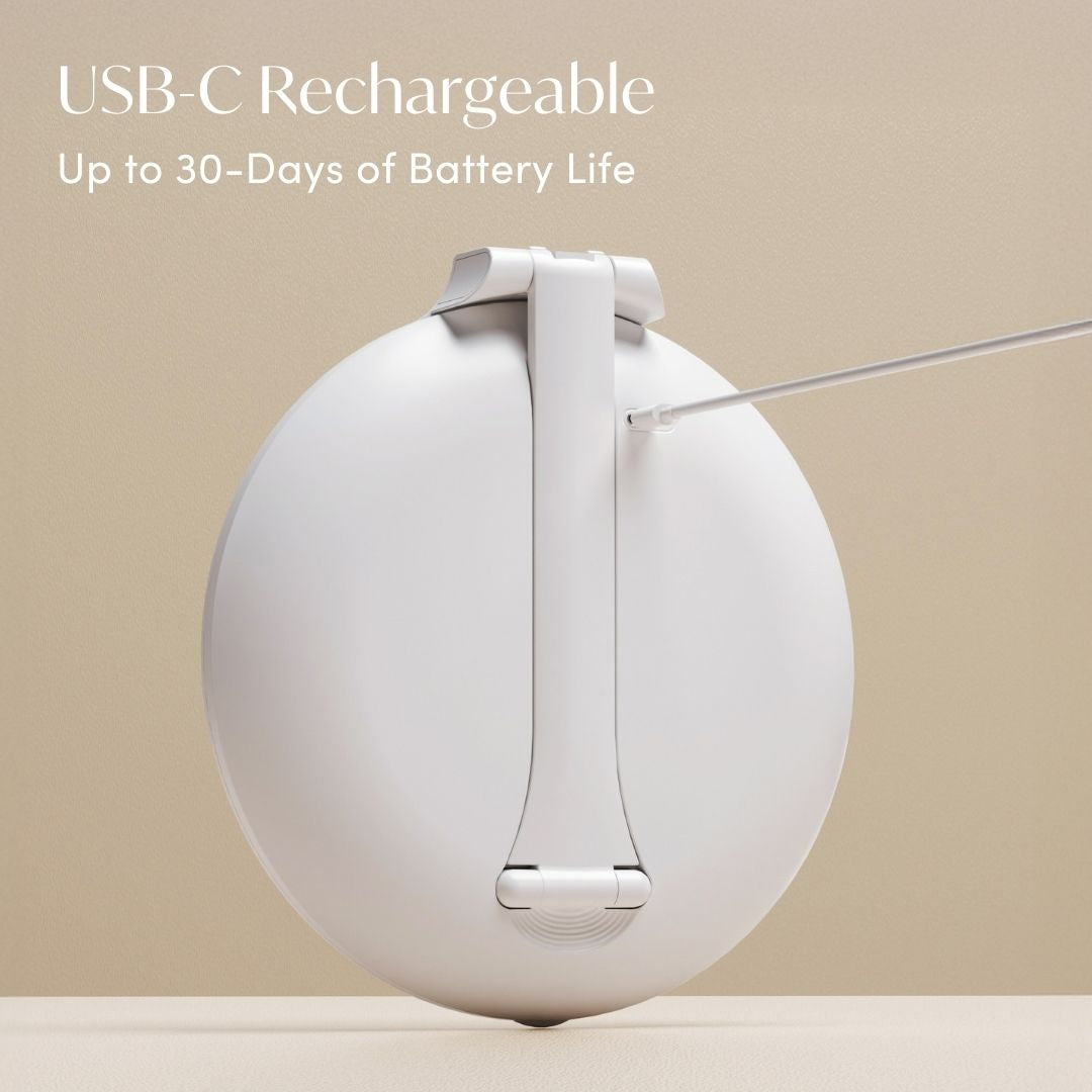 Abigail USB-C rechargeable travel mirror with 30-day battery life, showing portable 10x magnification mirror charging.