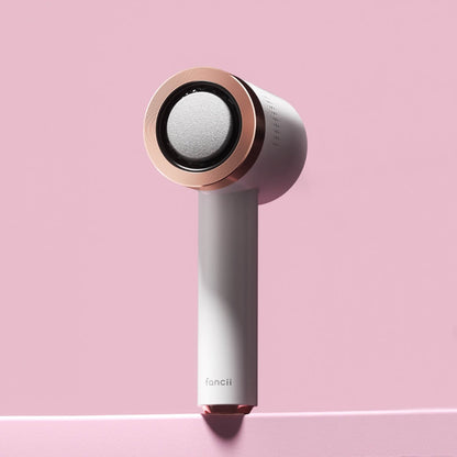 Cali white and rose gold electric callus remover professional foot file for pedicure care against a pink background.