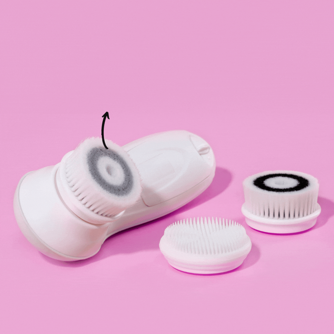 3-Pack Cora replacement facial brush heads showing daily cleansing, exfoliating, and silicone heads on a pink background.