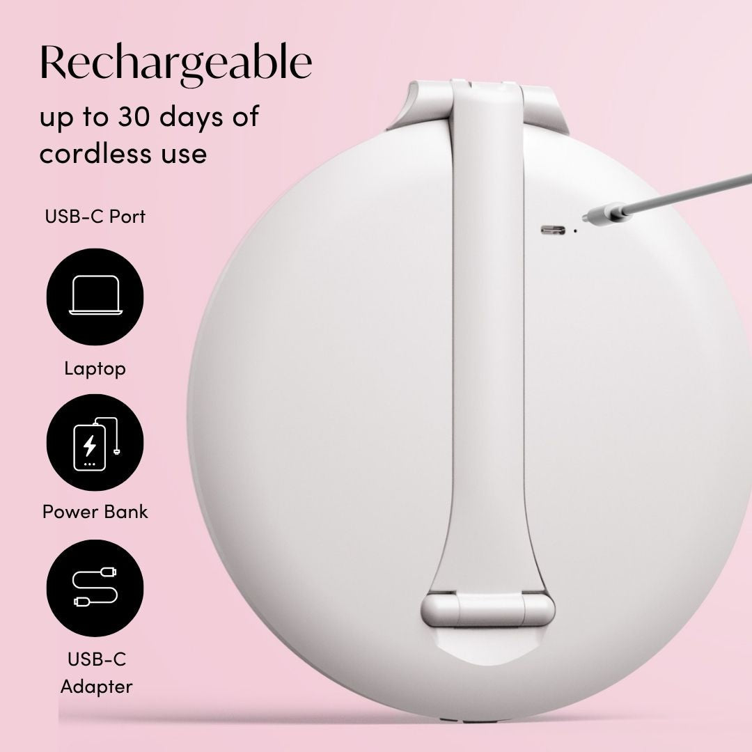 Abigail rechargeable LED travel mirror in white showing the back USB-C port for portable charging on a pink background.