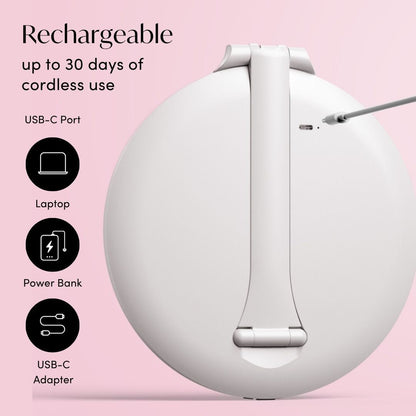 Abigail rechargeable LED travel mirror in white showing the back USB-C port for portable charging on a pink background.