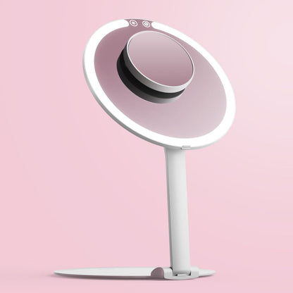 Abigail LED travel makeup mirror in white with ring light and adjustable stand against a pink background.