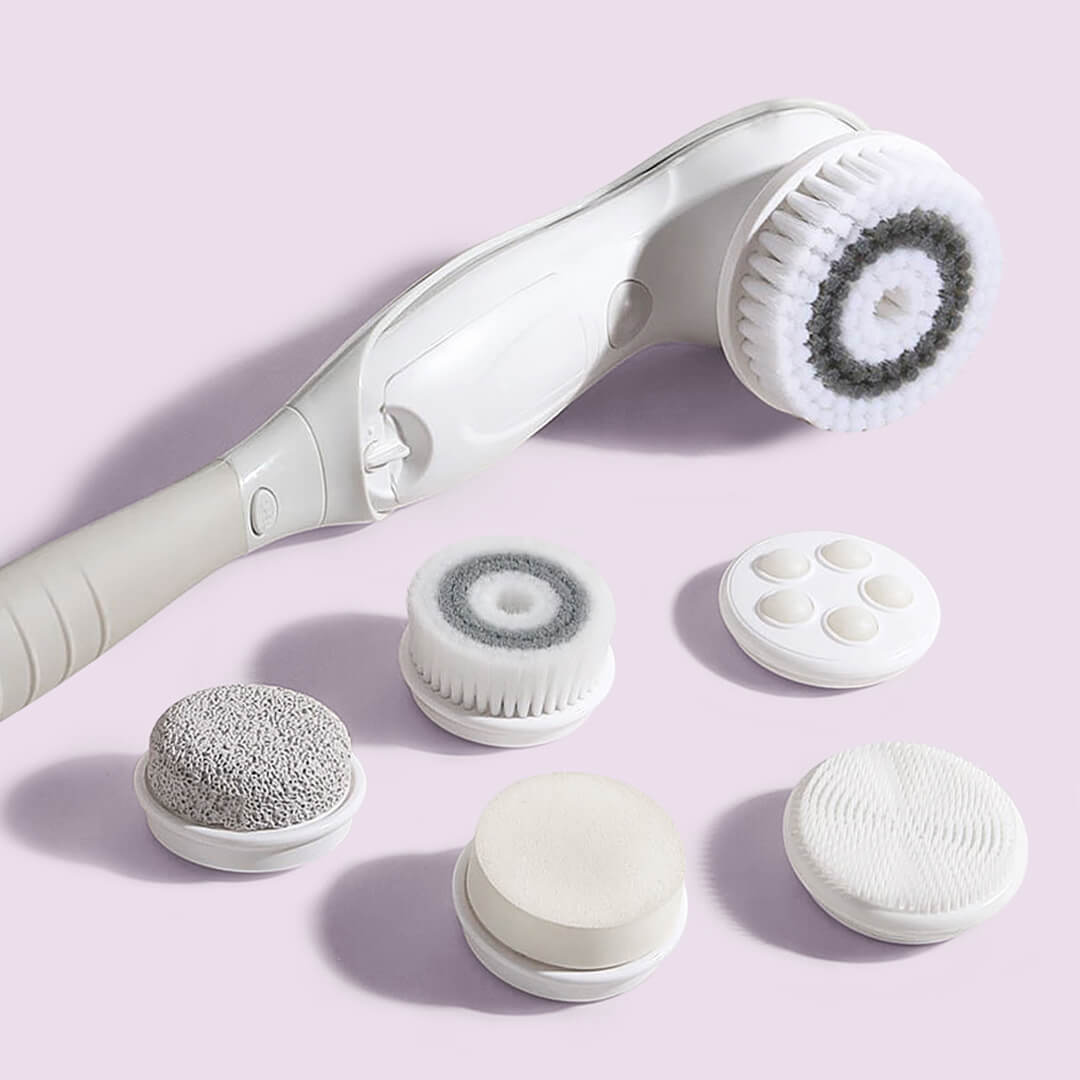 Cora 7 Electric Body Cleansing Brush with 6 interchangeable heads for facial exfoliation and massage on a lilac background.