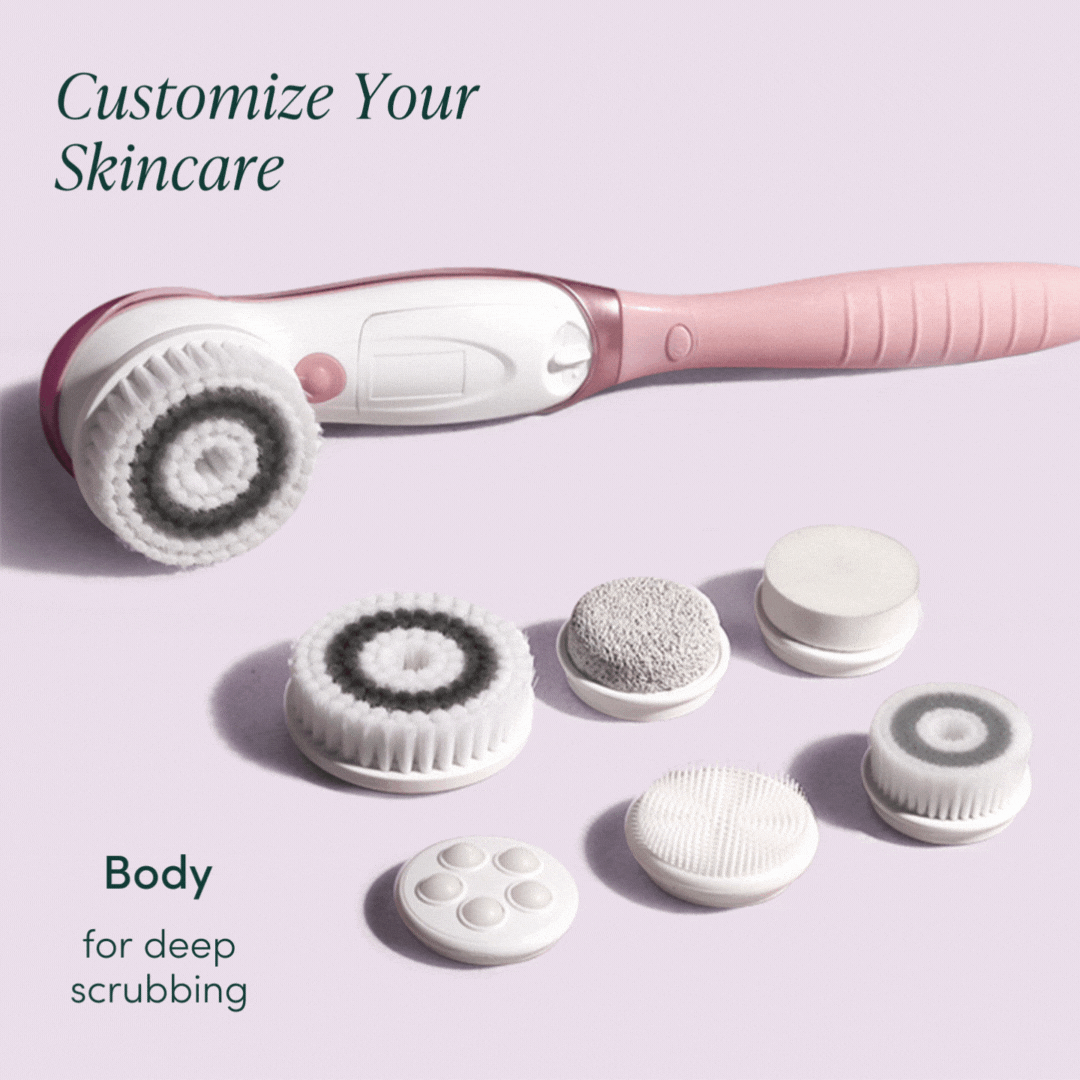 Cora 7 pink electric body cleansing brush set with 6 interchangeable exfoliating and massaging head attachments.