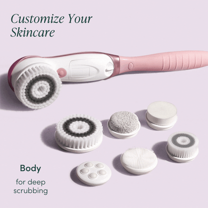 Cora 7 pink electric body cleansing brush set with 6 interchangeable exfoliating and massaging head attachments.