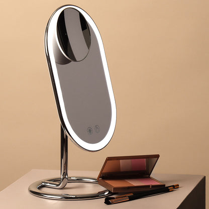 Lara 10x magnifying mirror magnetically attached to a lighted Vera vanity mirror with makeup palette and brushes.