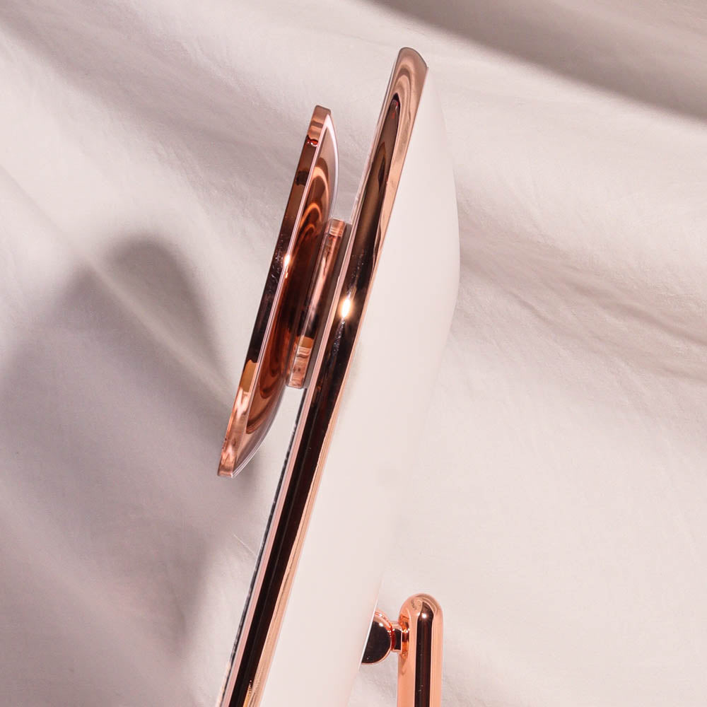 Side view of the Lara 10x magnifying mirror attachment magnetically secured to the Vera LED vanity mirror.