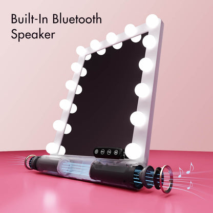 Madeline Mini Hollywood Mirror with built-in Bluetooth speaker, LED light bulbs, and touch controls on a pink background.