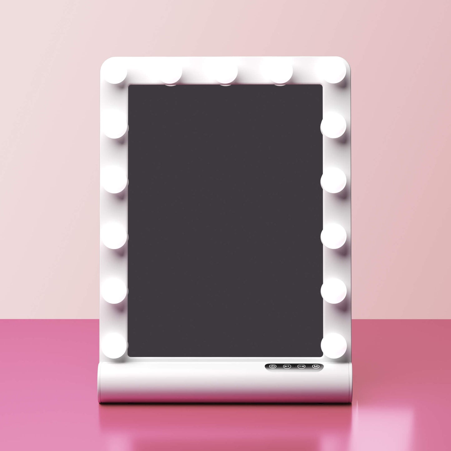 Madeline Mini Hollywood Mirror with LED bulbs, Bluetooth speaker, and touch controls on a pink vanity surface.