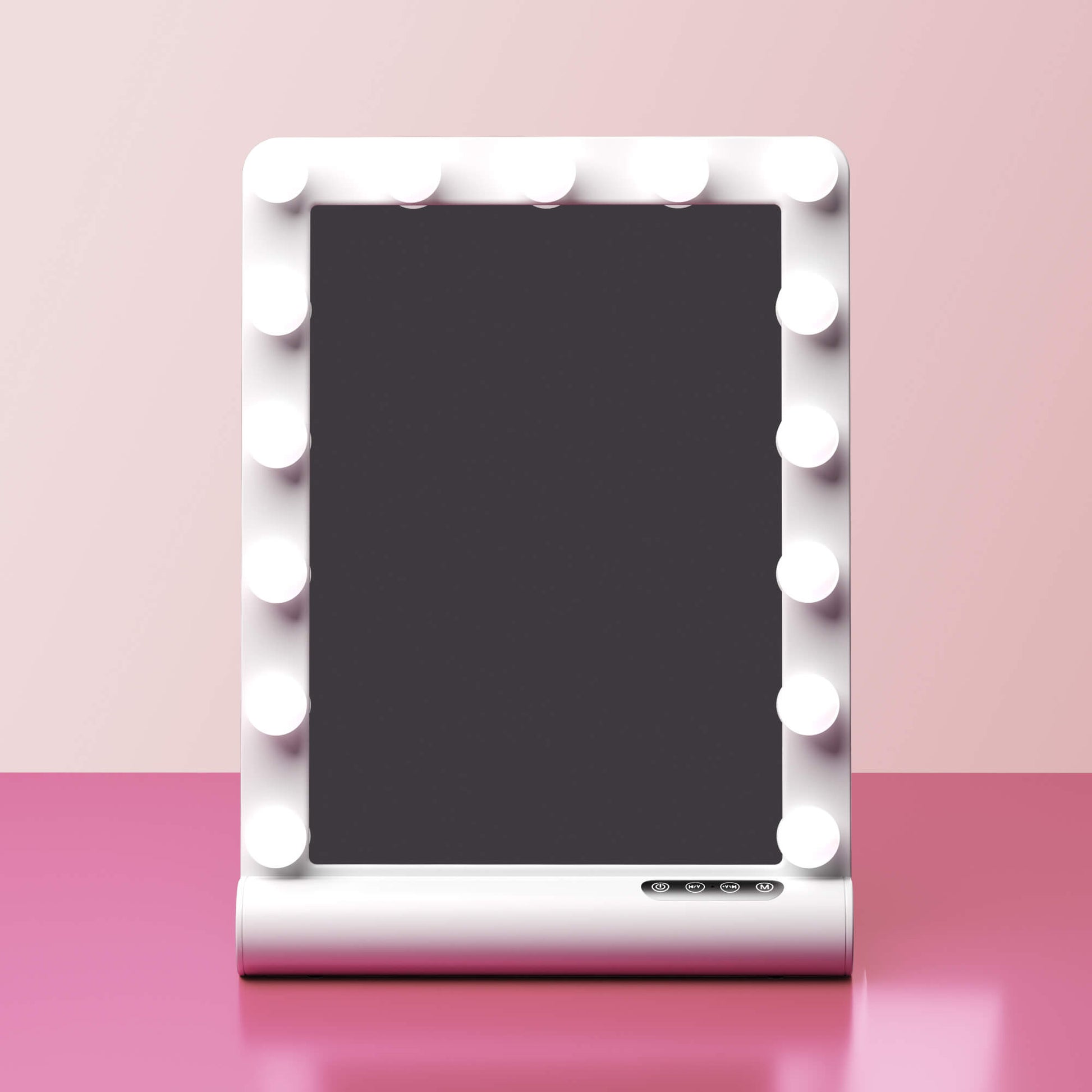 Madeline Mini Hollywood Mirror with LED bulbs, Bluetooth speaker, and touch controls on a pink vanity surface.