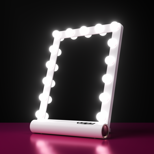 Madeline Mini Hollywood Mirror with dimmable LED bulbs, Bluetooth speaker, and touch controls on a white vanity frame.