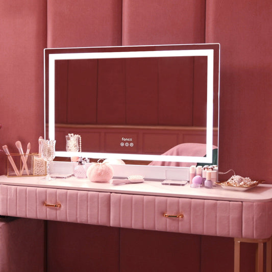 Monroe Hollywood Vanity Mirror with LED Omni-Glow lights on a pink velvet makeup desk with professional accessories.