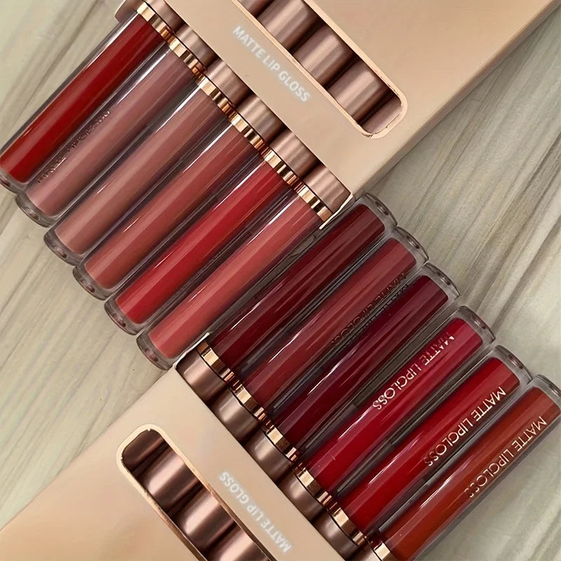 Luxe Glow 6-piece matte lip gloss kit featuring a range of red, berry, and nude shades in gold-capped tubes.