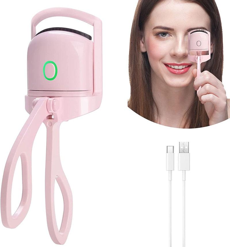 Pink LashWave electric heated eyelash curler with USB charging cable and woman demonstrating use for curled lashes.