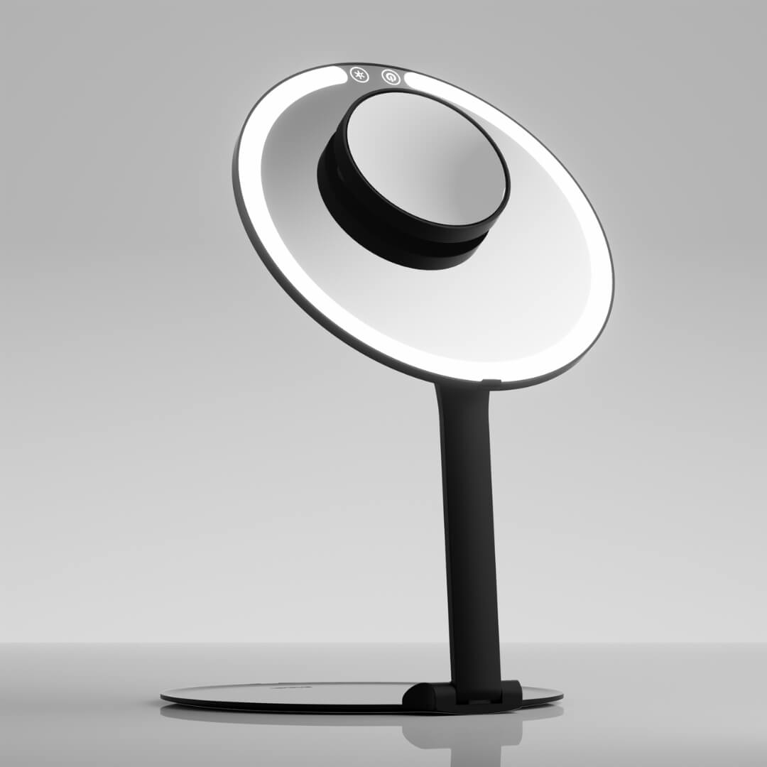 Abigail LED Travel Makeup Mirror in black with ring light and 10x magnifying attachment on a slim folding stand.