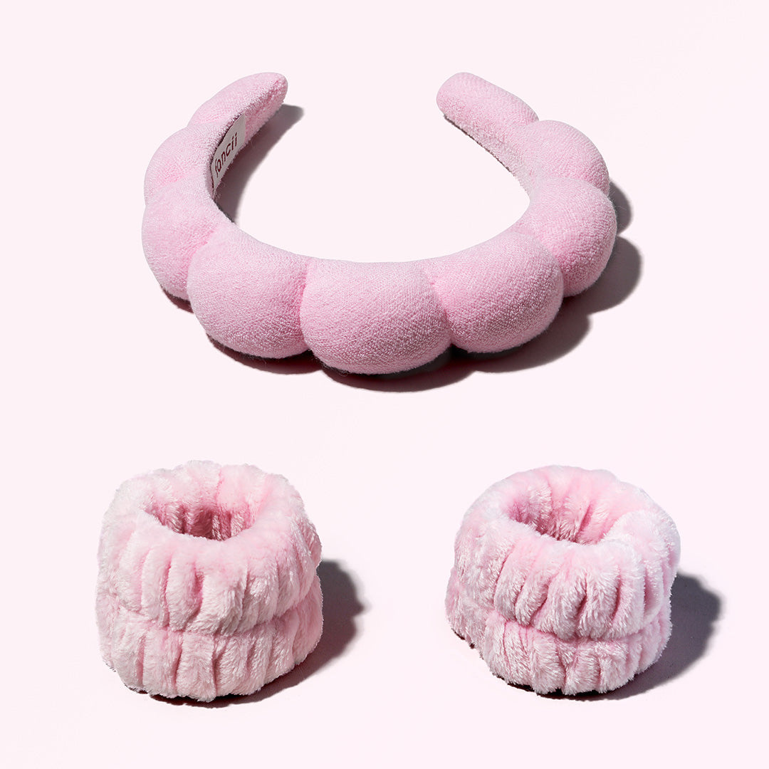 Pink Avery bubble spa headband and matching plush microfiber wristbands for face washing and skincare.