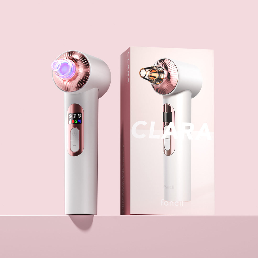 Clara 4-in-1 microdermabrasion device and blackhead remover with rose gold accents and LED light therapy, next to packaging.