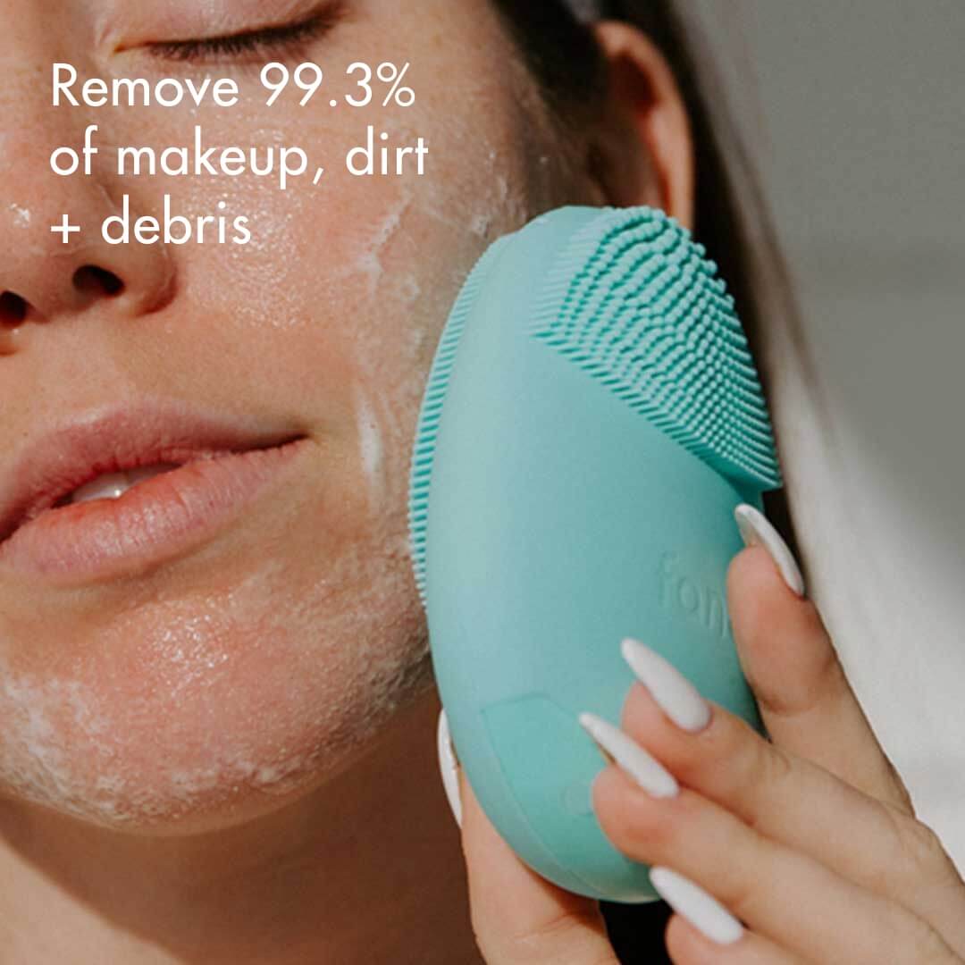 Isla sonic silicone facial cleansing brush being used on soapy skin to remove 99.3% of makeup and dirt.