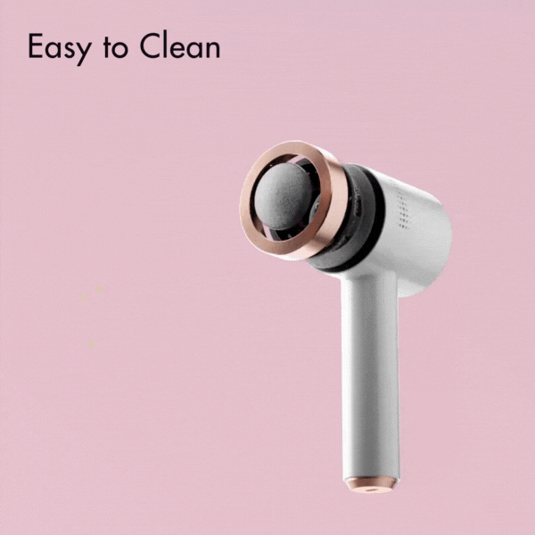 Cali Electric Callus Remover with easy-to-clean detachable rose gold head and white ergonomic handle on pink background.