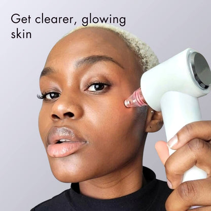 Clara microdermabrasion tool and pore vacuum being used by a woman for exfoliation and blackhead removal.