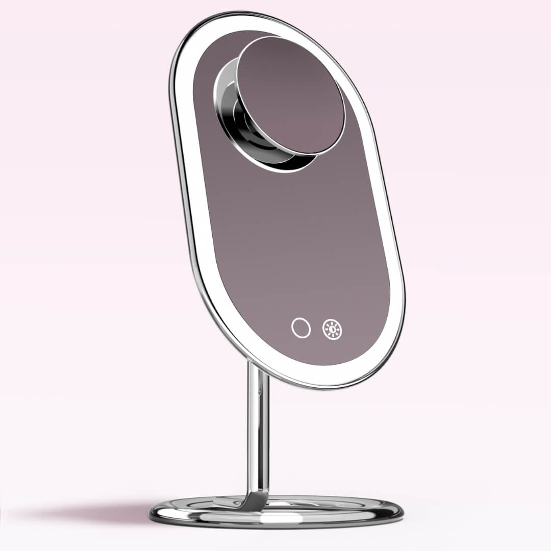 Vera LED vanity mirror in pink with magnetic 10x Lara magnifying mirror attachment and Tru Glow lighting system.