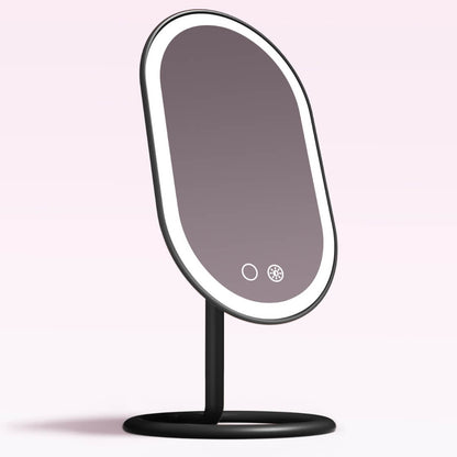 Vera Lighted Vanity Mirror with oval LED makeup mirror light, sleek black aluminum frame, and tilting sturdy base.